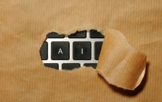 A piece of cardboard with a keyboard appearing through it